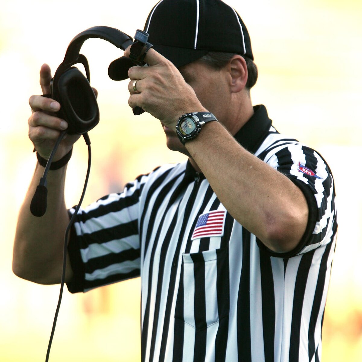 https://images.pexels.com/photos/163039/football-american-football-referee-referee-football-official-163039.jpeg?cs=srgb&dl=pexels-163039.jpg&fm=jpg