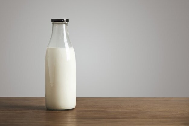 https://img.freepik.com/free-photo/simple-vintage-bottle-filled-with-fresh-milk-on-thick-wooden-table-closed-with-black-cap-cafe-shop_346278-510.jpg?size=626&ext=jpg&ga=GA1.2.69746986.1655371539