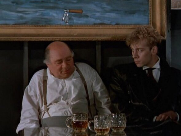 Кадр из фильма. Яндекс.Картинки. Знаменитый эпизод разговора возле картины с краном, где сын спрашивает своего отца Бургомистра, может ли Ланцелот победить Дракона?