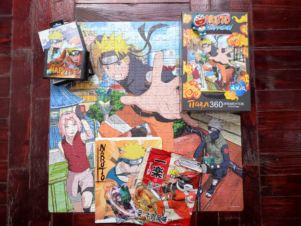 Фото из моей личной коллекции. Публикация фото преследует информационные цели. На фото: Игра настольная Пазл, 360 элементов, 475х475 мм, ООО «Группа компаний Оригами»,  Тетрадь школьная, ООО «Полиграф Принт». Пакетик Лапшы быстрого приготовления, Китай, Импортер «ООО Снекотрейд», Коробка от игры Наруто, на 16 бит. приставку. Подробнее указано в статье. Автор манги Масаси Кисимото, режиссер аниме сериала Хаято Датэ.
