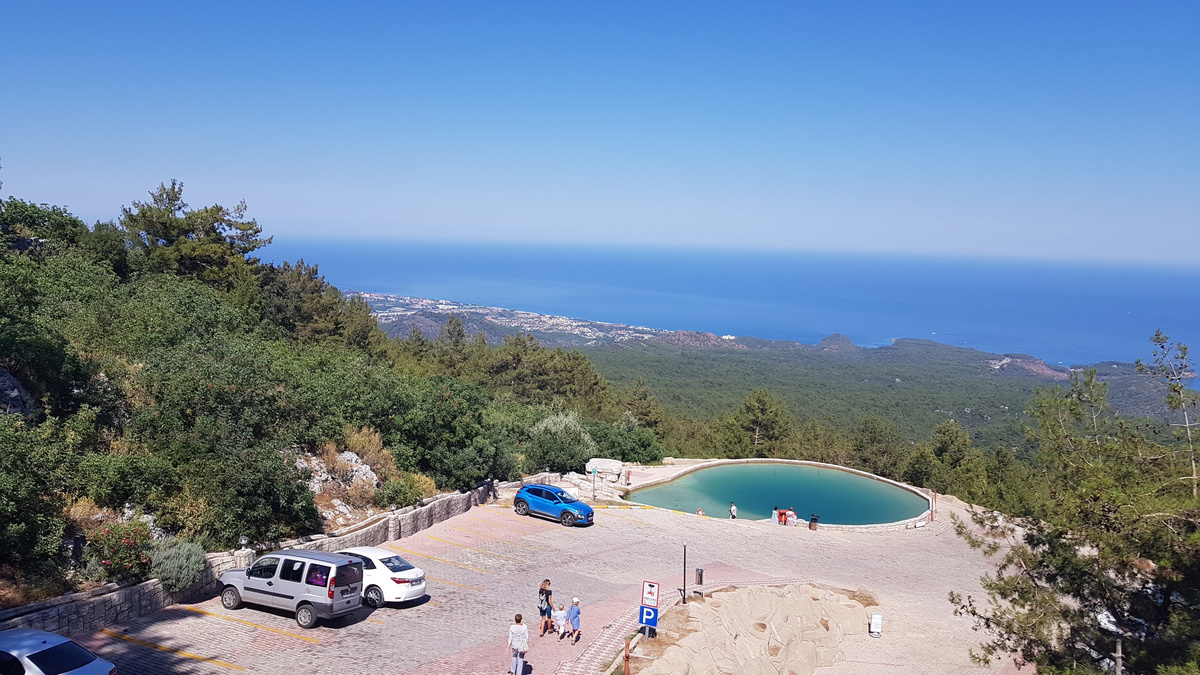 Место под названием Olympos Teleferik, там находится подъемник на гору, но цена на столько конская, что нафиг надо и так красиво...
