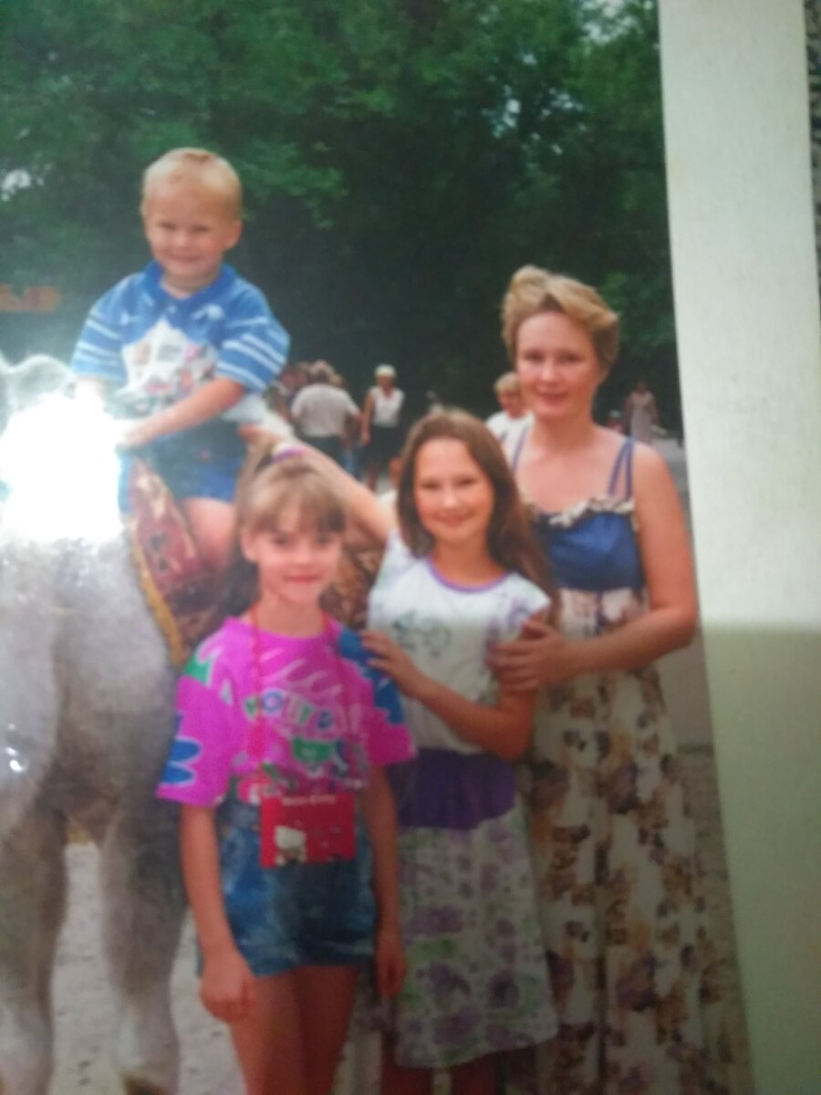 Моя старшая в белой маечке, а на верблюде младший.