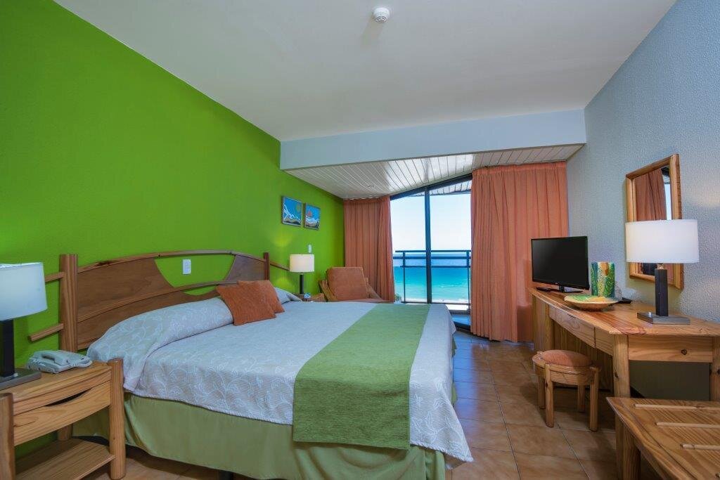 фото номера https://www.booking.com/hotel/cu/gran-caribe-puntarena-playa-caleta.ru.html