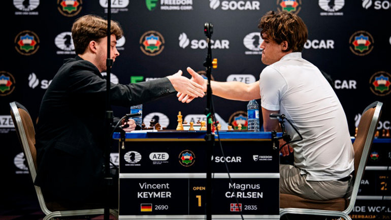    Винсент Кеймер и Магнус Карлсен.FIDE