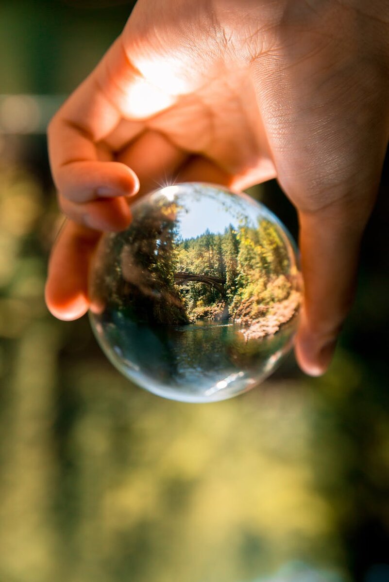 https://www.pexels.com/photo/person-holding-clear-glass-ball-1296265/