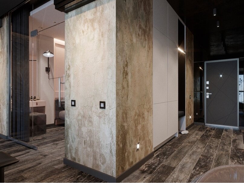 Палитра интерьера в целом сдержанная, преимущественно темная. Темно-графитовый потолок оттенен теплым оттенком штукатурки на стенах и паркетной доски.