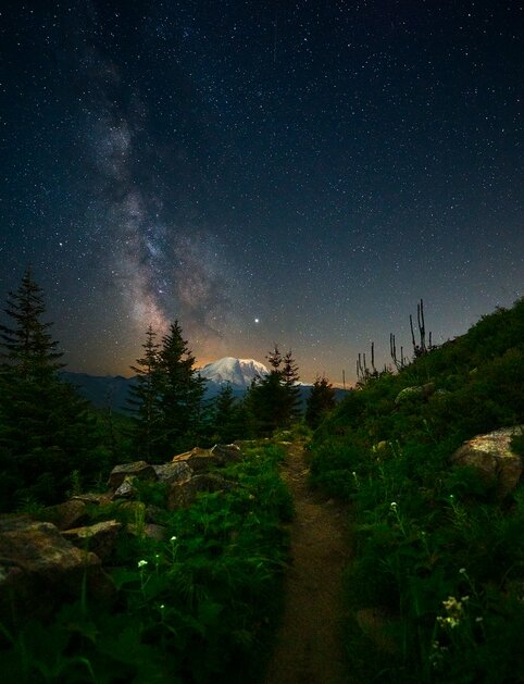 

Title:Mt Rainier

Camera:Sony E-mount Lens:14-24mm F2.8 DG DN | A
Description:

When I found out I was going to get the chance to test out the new 14-24 f2.8 that had been completely redesigned for mirrorless, I was more than just a bit excited. Although uncooperative weather on my trip to photograph Mt. Rainier would limit my time, I was determined to make the most of it. Setting up, the fast 2.8 aperture made using live view to nail my focus on the stars feel effortless. I hit the shutter for my first exposure with the aperture wide open. I waited, checked the corners, smiled, and got right to shooting. I only had time to take a few shots, but I already couldn't wait to see the images on a larger screen. Getting to see the sharpness across the entire frame put the quality of this lens on another level. The 14mm to 24mm may be a classic focal range for astrophotography, but there's undoubtedly a new champion when it comes to fast, ultra wide angle zoom lenses. 
