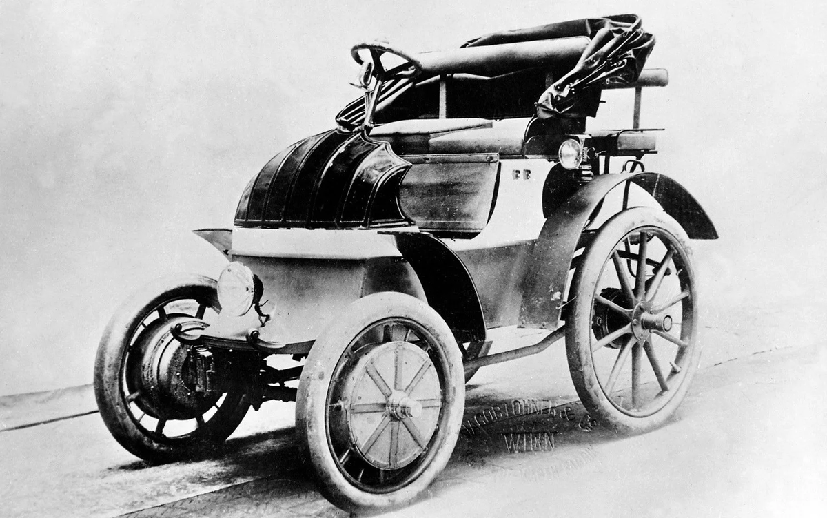 Машина 1 века. Lohner-Porsche гибридный автомобиль. Электромобиль Lohner Porsche. Фердинанд Порше электромобиль. Фердинанд Порше первый автомобиль