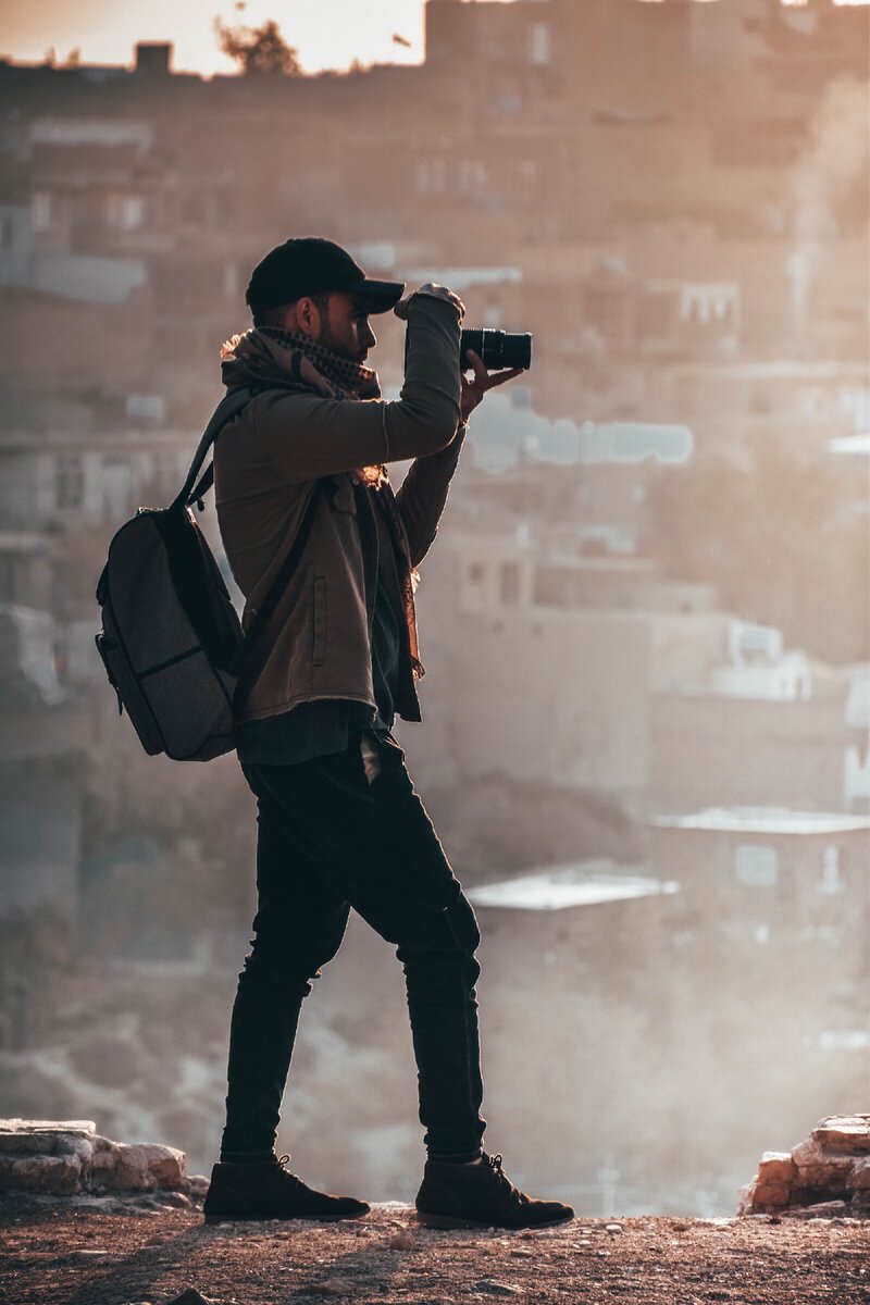https://www.pexels.com/photo/man-holding-black-dslr-camera-1540977/