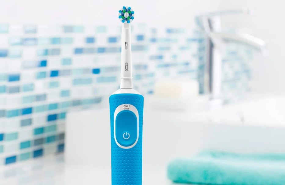 Электрическая зубная щетка