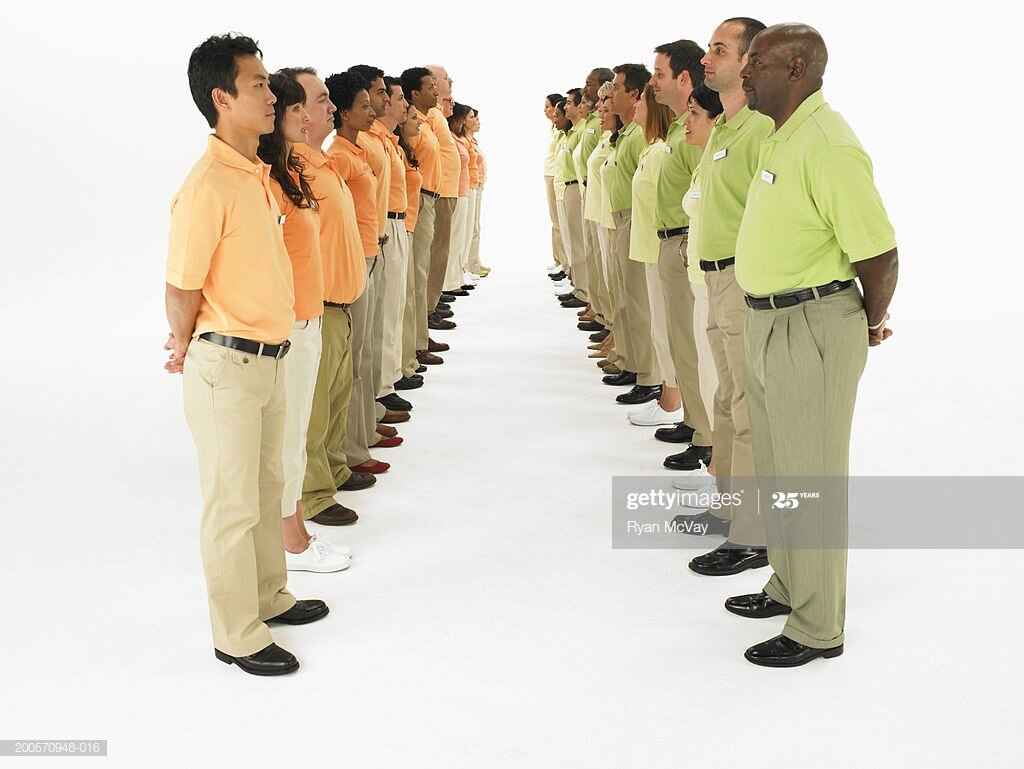 https://media.gettyimages.com/photos/opposite-rows-of-people-wearing-orange-and-green-polo-shirtsside-view-picture-id200570948-016