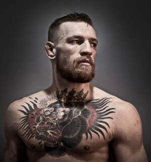 Конор Энтони МакГрегор (Conor Anthony McGregor). Родился 14 июля 1988 года в Дублине (Ирландия). Ирландский боец смешанных боевых искусств. Выступает под эгидой «UFC» в легкой и полулёгкой весовых категориях. Бывший чемпион UFC в лёгком весе и бывший чемпион в полулёгком весе. Занимает восьмую строчку официального рейтинга UFC среди лучших бойцов независимо от весовой категории (pound-for-pound). Рейтинг Sherdog ставит МакГрегора на первое место в полулёгком весе и на восьмое в списке лучших бойцов вне зависимости от весовой категории. Считается одним из лучших в MMA мастеров самопиара, умеющим привлекать к себе внимание и, соответственно, накручивать свои гонорары. Конор умело устраивает провокации и скандалы, которые становятся темой обсуждения в СМИ. Порой трудно понять, где боец МакГрегор, а где шоумен МакГрегор. Рост Конора МакГрегора: 175 сантиметров. Размах рук Конора МакГрегора: 188 сантиметров. Прозвище Конора МакГрегора: The Notorious.Конор МакГрегор родился 14 июля 1988 года в Дублине. Вырос в южной части Дублина - в пригороде Крамлин. Там он впервые заинтересовался спортом, правда, сначала увлекался футболом. Он играл за футбольный клуб «Лудерс Селтик» и болел за клуб английской премьер-лиги «Манчестер Юнайтед». Конор МакГрегор в детстве (12 лет)
