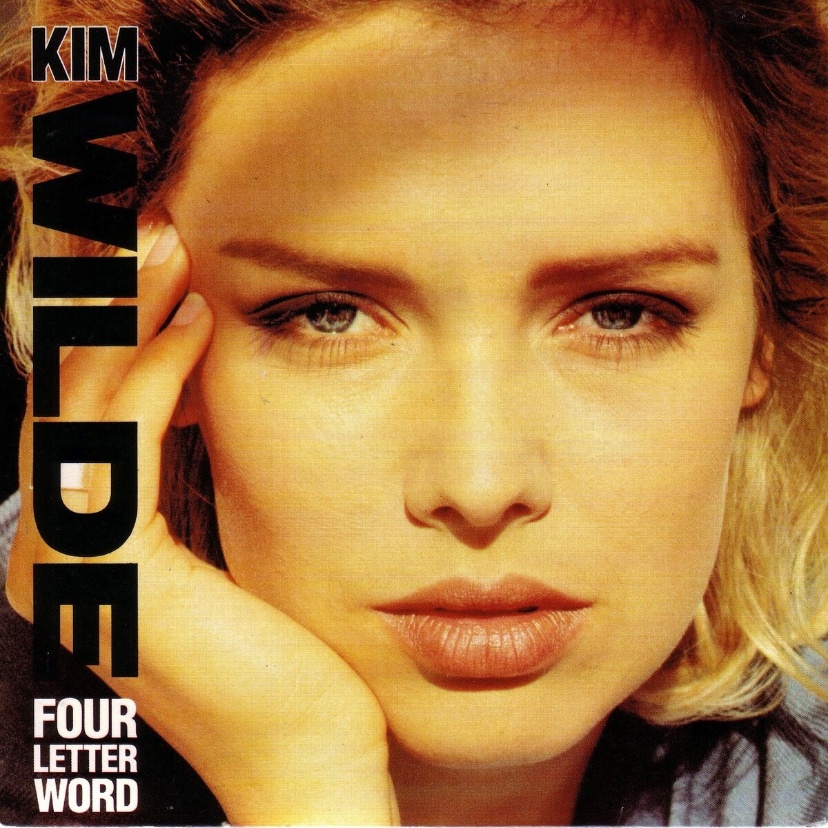 Обложка сингла "Four Letter Word" британской поп-певицы, ди-джея и телеведущей Kim Wilde