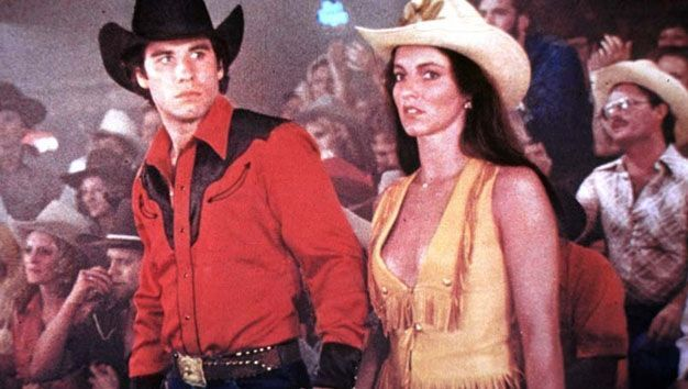 Джон Траволта и Мэдолин Смит в фильме «Городской ковбой». Кадр из фильма