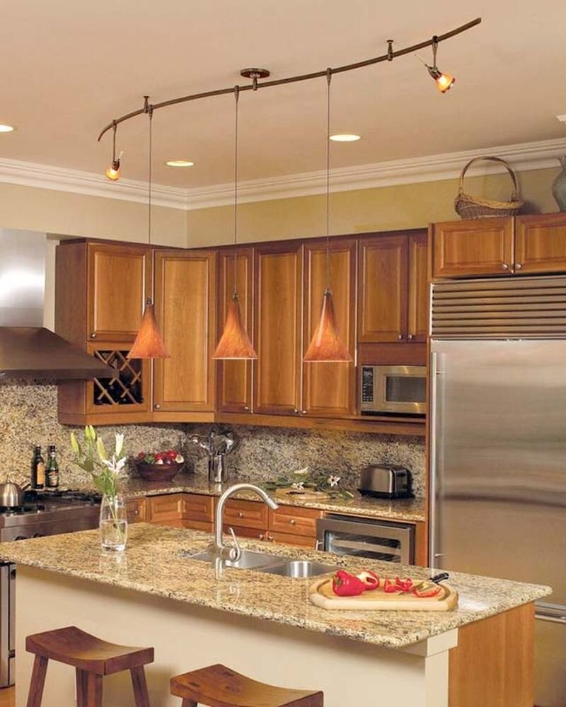 Столешница из искусственного камня в интерьере кухни с островом и барной стойкой.