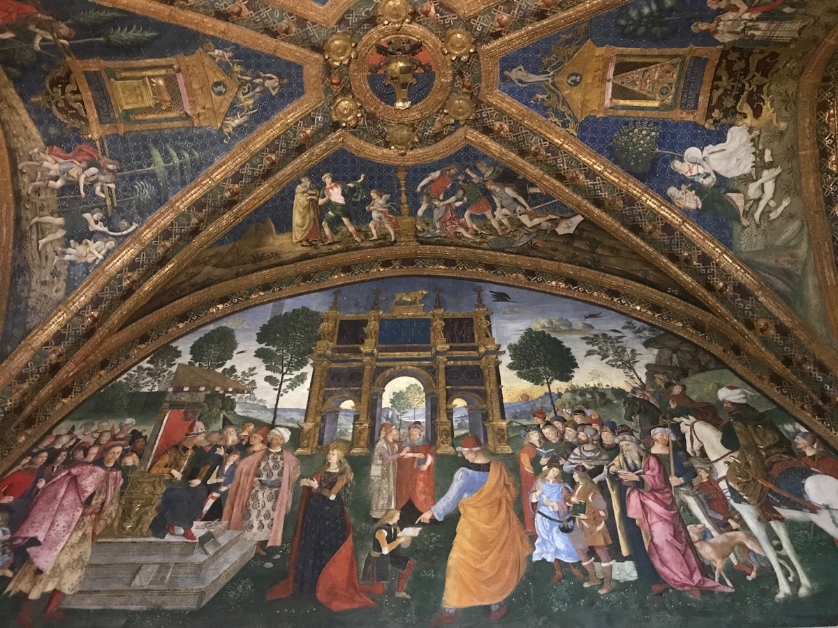 Фреска в комнатах Борджиа в Ватикане. Предположительно, в образе Иисуса Христа изображен Чезаре Борджиа (сидит на троне слева), а перед ним склоняет колени в образе Святой Екатерины его сестра Лукреция Борджиа.