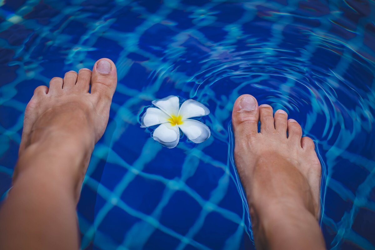 https://www.pexels.com/photo/person-s-feet-on-swimming-pool-965988/