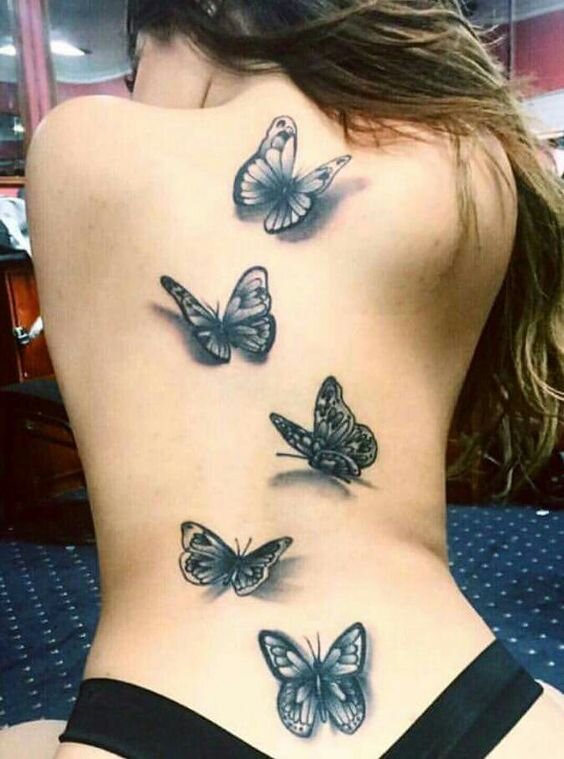 Татуировка бабочка на шее.