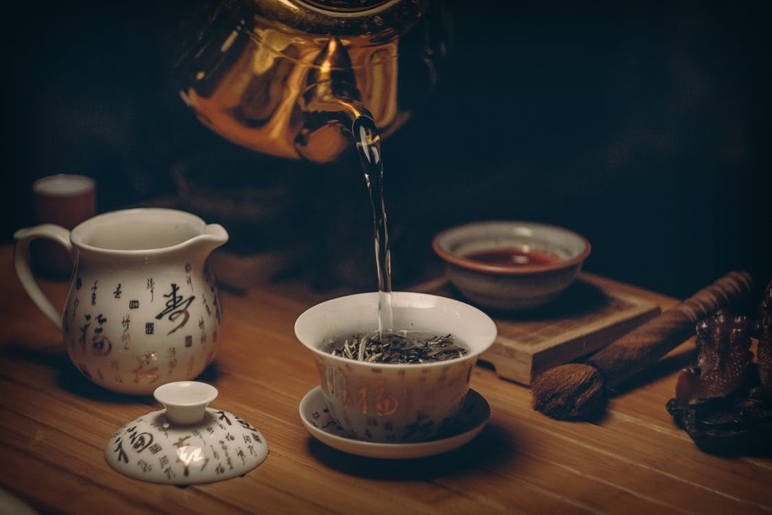 https://www.pexels.com/photo/gold-kettle-pouring-hot-water-on-cup-of-tea-230477