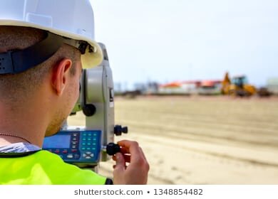 https://image.shutterstock.com/image-photo/surveyor-engineer-measuring-level-on-260nw-1348854482.jpg