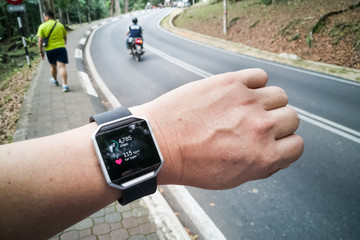 https://stock.adobe.com/ru/images/perspective-view-of-person-checking-tracker-watch-during-exercise/143633866