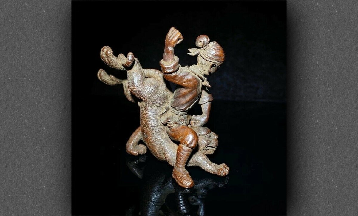 Статуэтка "У Сун забивает тигра". Фотографий несколько, листайте галерею.