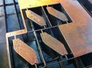 Плазменная резка соответствует практически всем параметрам «идеальной технологии», т.к. эффективна до толщины 150 мм (большая часть листового проката), обеспечивает высокую скорость, в несколько раз выше, чем газовая, дает хорошее качество среза без сильного нагрева металла рядом с ним.Плазма представляет собой высокотемпературный ионизированный газ, способный пропускать электрический ток. Между соплом и разрезаемым металлом загорается электрическая дежурная дуга. В дуговую камеру из плазмотрона (генератора плазмы) подаётся плазмообразующий газ под высоким давлением, который под действием дежурной дуги ионизируется, расширяется за счёт теплового расширения в 50-100 раз, в итоге через сопло выходит рабочая режущая дуга со скоростью 2000-3000 м/с, при этом дежурная дуга выключается. Толщина разрезаемого металла может достигать 200 мм. Температура дуги при выходе может достигать 30000 C. Плазменная камера (форсунка) охлаждается воздушным или жидкостным охлаждением. Воздушные форсунки являются дешевой альтернативой форсункам с жидкостным охлаждением применяются в основном в аппаратах небольшой мощности до 100А и дают менее качественный рез. В более мощных - промышленных аппаратах более 100А используются резкаки с жидкостным охлаждением, это позволяет резать на больших токах с минимальным износом расходных деталей. Более подробно о технологии плазменной резки вы можете почитать на сайте мировых производителей источников плазмы: Hypertherm, Kjellberg и др.Газы, применяемые для получения  плазмы,  делятся на активные (воздух, O2) и инертные (Ar, H2, N2). Воздух и кислород используются в основном  для раскроя черных металлов, а аргон, водород и азот для цветных металлов и сплавов.Сильные стороны плазменной резки - это отсутствие существенных трудозатрат, низкая ресурсоёмкость, очень высокая скорость реза по сравнению с альтернативными решениями, простота обслуживания. Данное оборудование не требует частой замены расходных материалов и обеспечивает неплохое качество пробивки листа вне зависимости от его толщины и размера


 