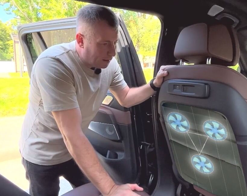 Владелец бракованного "баварца" демонстрирует дефектную систему вентиляции сидений