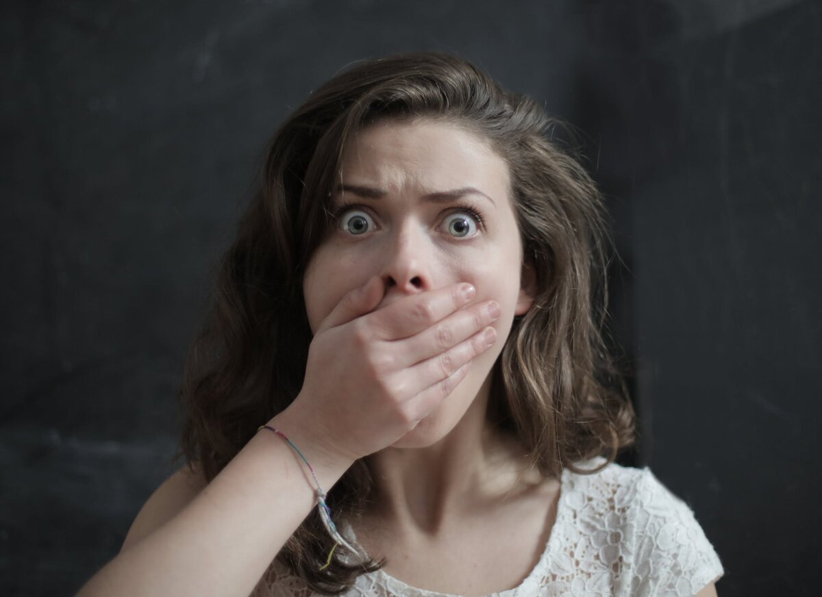 https://www.pexels.com/photo/woman-covering-her-mouth-3986935/