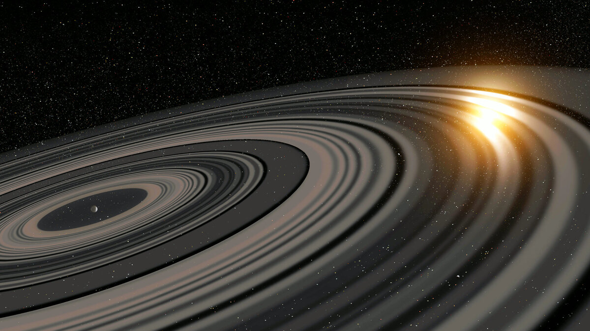 Представление художника о системе колец, вращающихся вокруг экзопланеты J1407b. Фото: Ron Miller