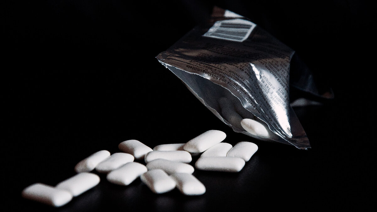Photo by https://www.wallpaperflare.com/chewing-gum-table-scattered-packaging-silver-black-background-wallpaper-etjhk