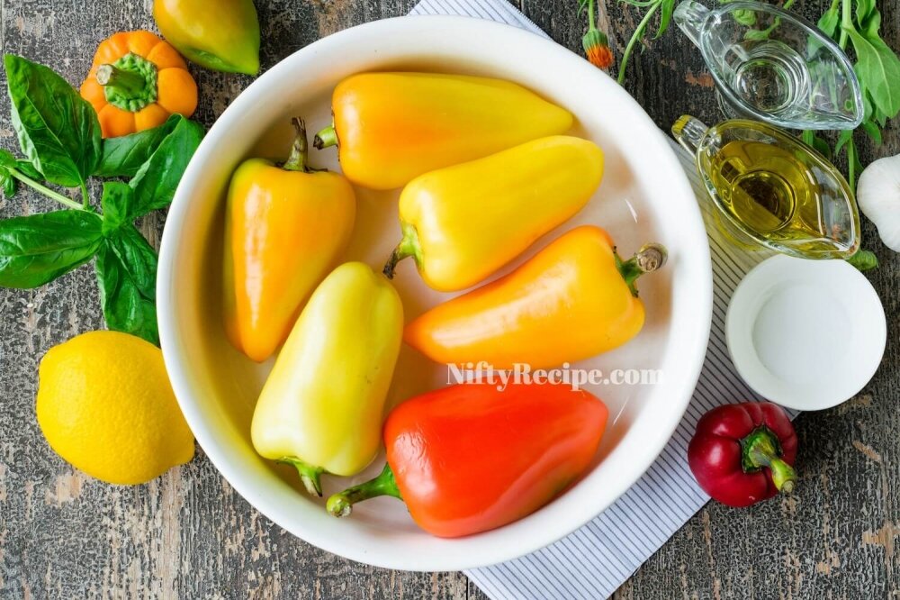 1. Wash bell peppers and transfer them into a heat-resistant form for baking.