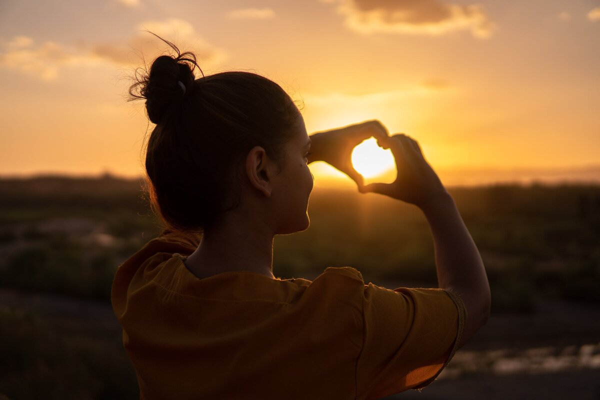 https://www.pexels.com/photo/woman-doing-hand-heart-sign-1535244/