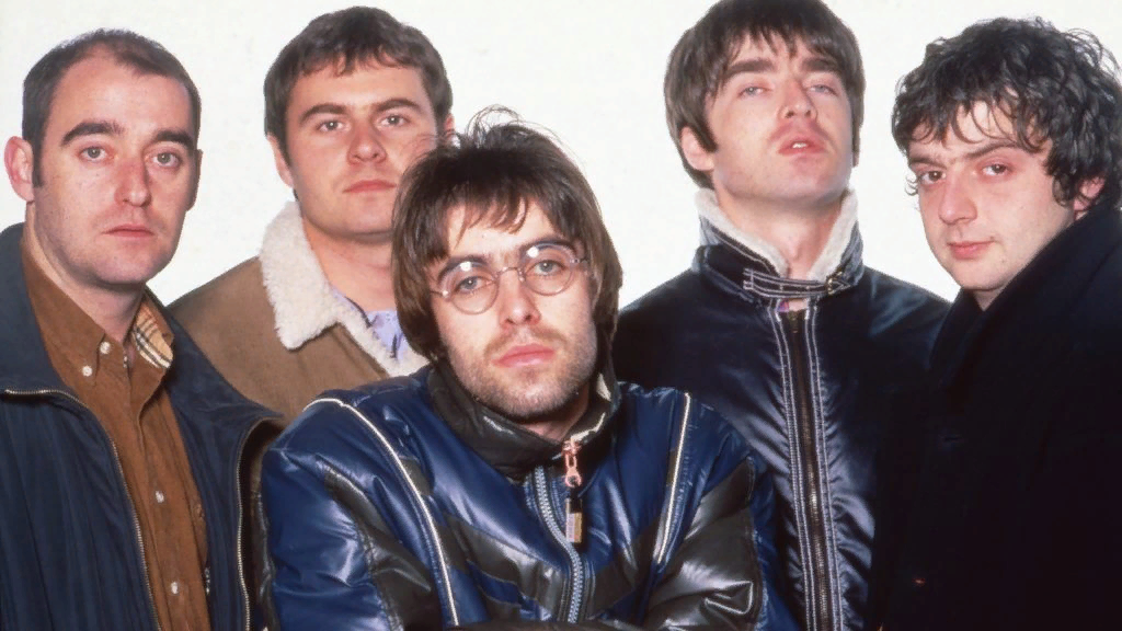 Состав Oasis в 1996 году. Слева направо: Бонхэд, Алан Уайт, Лиам Галлахер, Ноэл Галлахер, Гигзи.