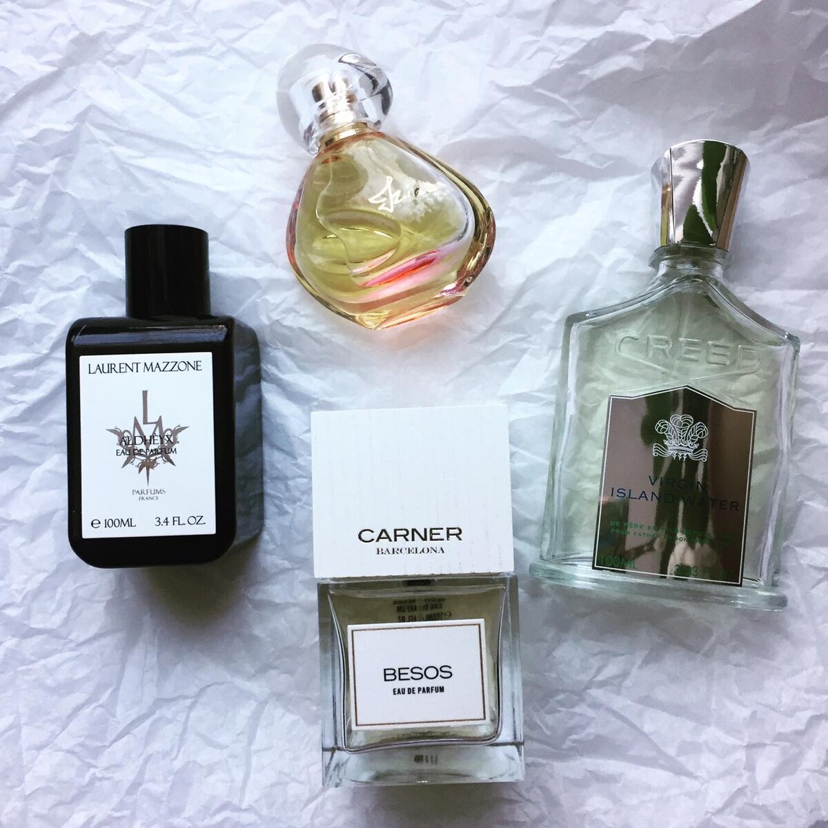 На фото: LM Aldheyx, Carner Besos, Creed Virgin Island Water, Sisley Izia