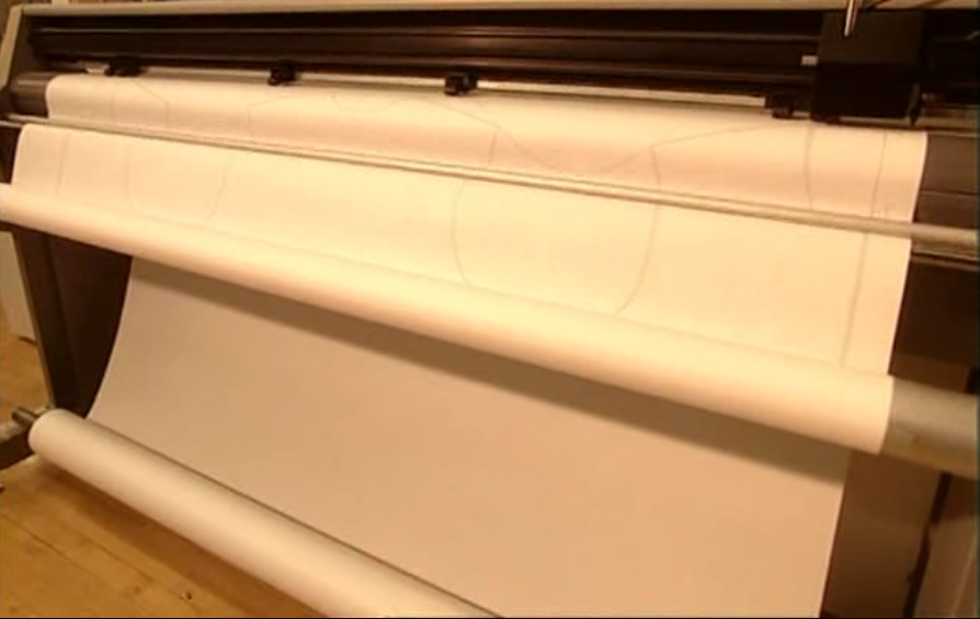 Огромный принтер переносит их на бумагу.