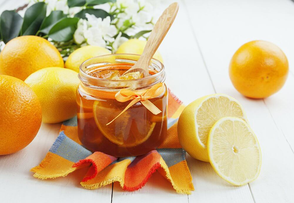 Можно мед при простуде. Апельсиновый мед. Мед и апельсин. Мед лимон апельсин. Цитрусы и мед.