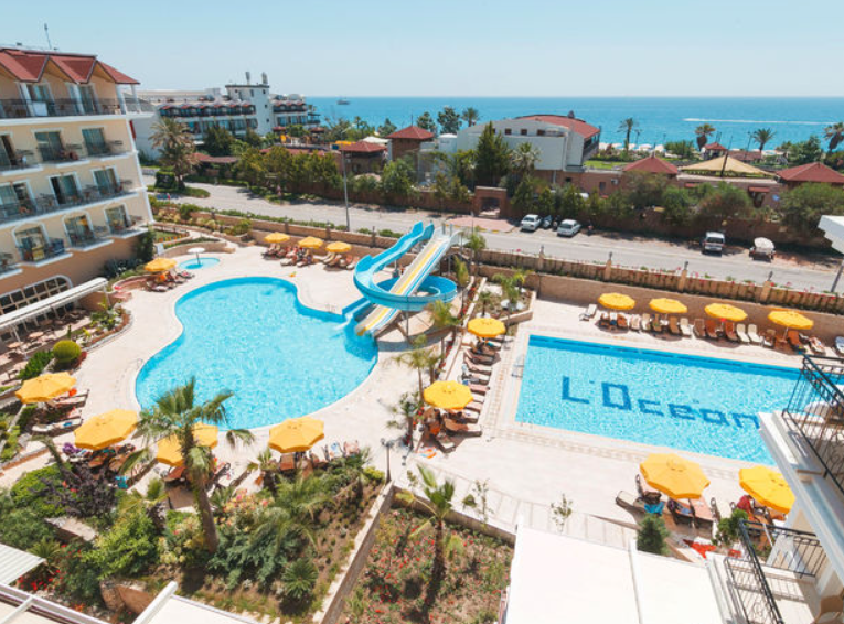 Локеаника отель турция кемер. Camyuva beach hotel. L oceanica beach resort 5 турция кемер. L oceanica beach resort hotel 5 турция. Отель океаника кемер турция.