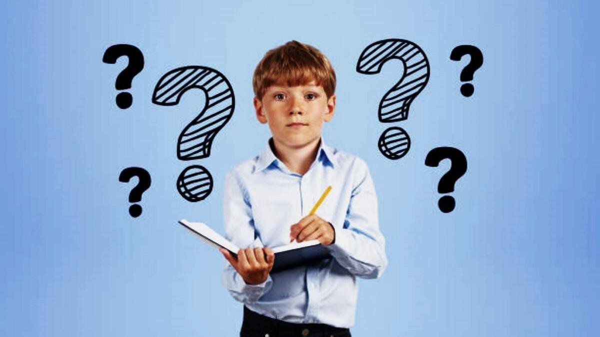    Мальчик с книгой и карандашом:iStockPhoto