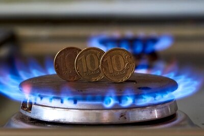    Монеты номиналам десять рублем на газовой плите. ©Алексей Даничев РИА Новости