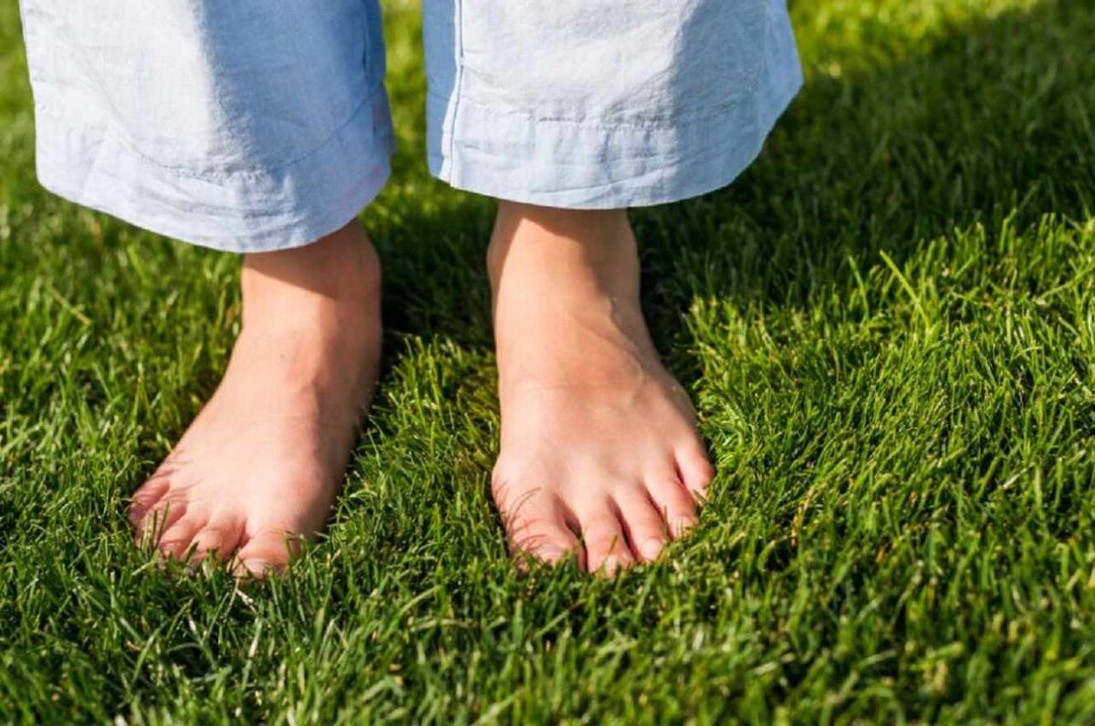 Girl standing on one foot.