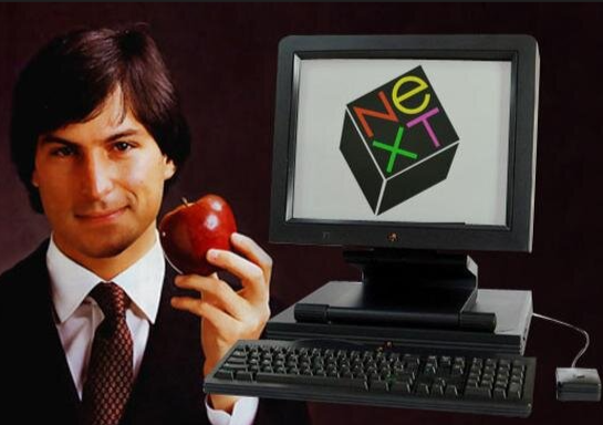 Is next to the computer. Next Стив Джобс. Next фирма Джобса. Компьютеры next Стив Джобс. Логотип next Стив Джобс.