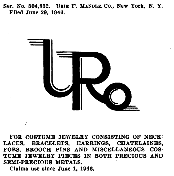 Из опубликованного выше материала можно узнать , что данный товарный знак выдан для нью йоркской компании Юри  Мандле , заявка подана 29 июня 1946 года для бижутерии , включая ожерелья браслеты ... сделанные из как драгоценных , так и полудрагоценных металлов . С началом использования 1 июня 1946 года .