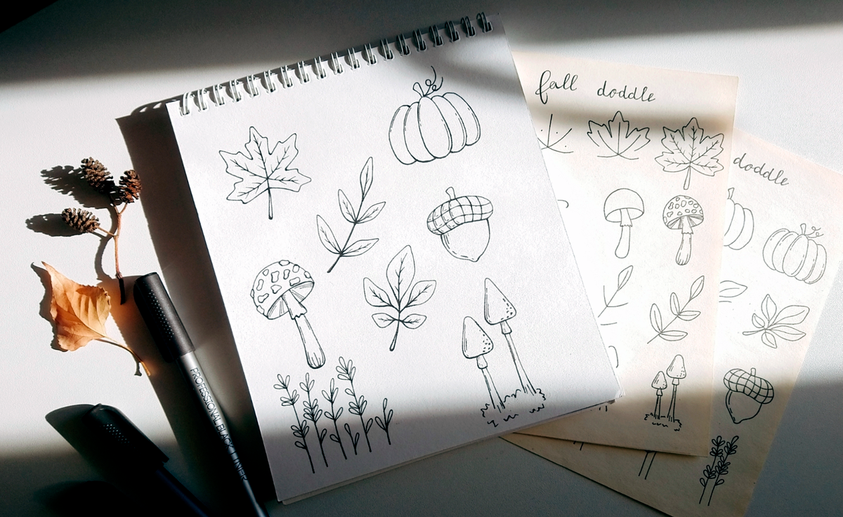 Блокнот и листы со схемами простых рисунков, которые приведены ниже