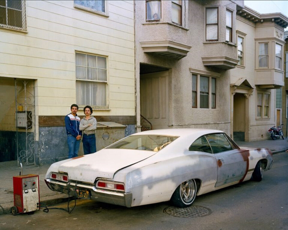 Impala. Charging battery, Moss Street, 1982