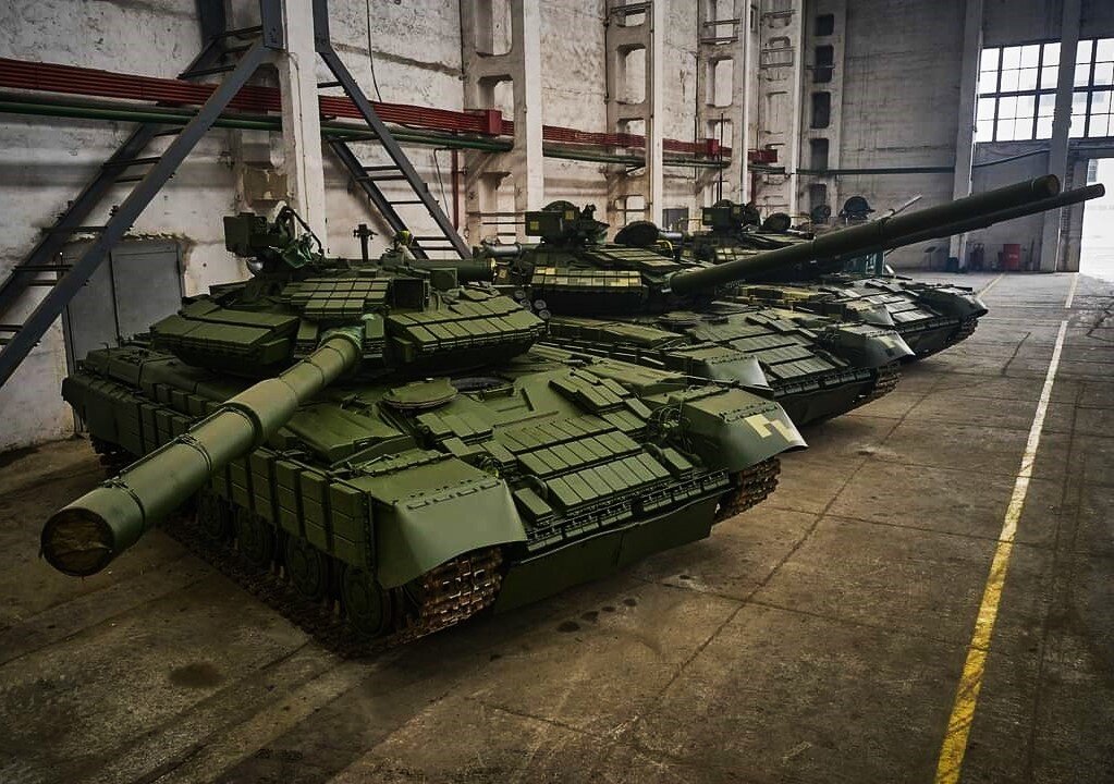 В заводском цеху.