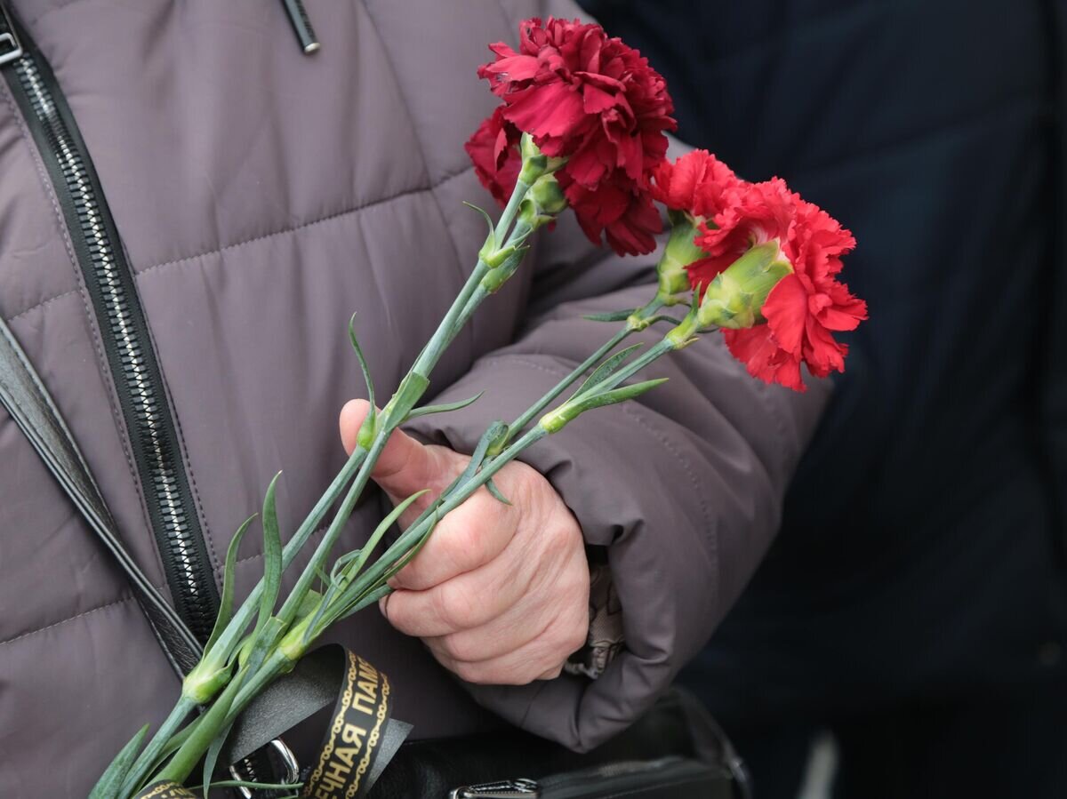    Женщина на церемонии прощания© РИА Новости / Сергей Аверин