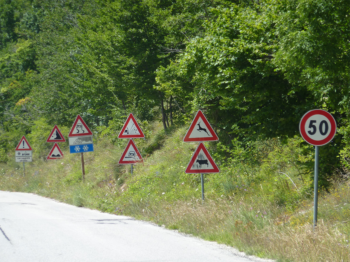 Потому, что только на скорости не более 50 км/ч вы сможете прочитать все эти знаки?