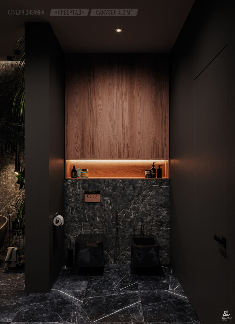 Интерьер санузла, черная сантехника на фоне отделки черным керамогранитом под благородный камень