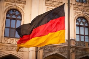    German flag on flagpole waving in the wind Даниил Кугушев